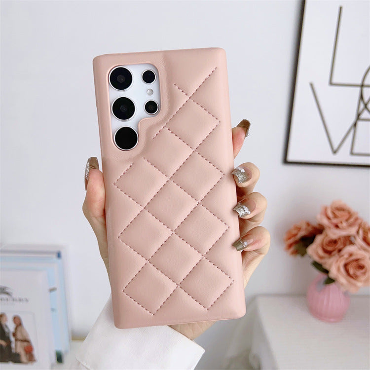 A stylish pink quilted Samsung Case being held in hand, showcasing its trendy design, part of the vibrant SAMSUNG CASES collection, perfect for protecting your device while enhancing your style.